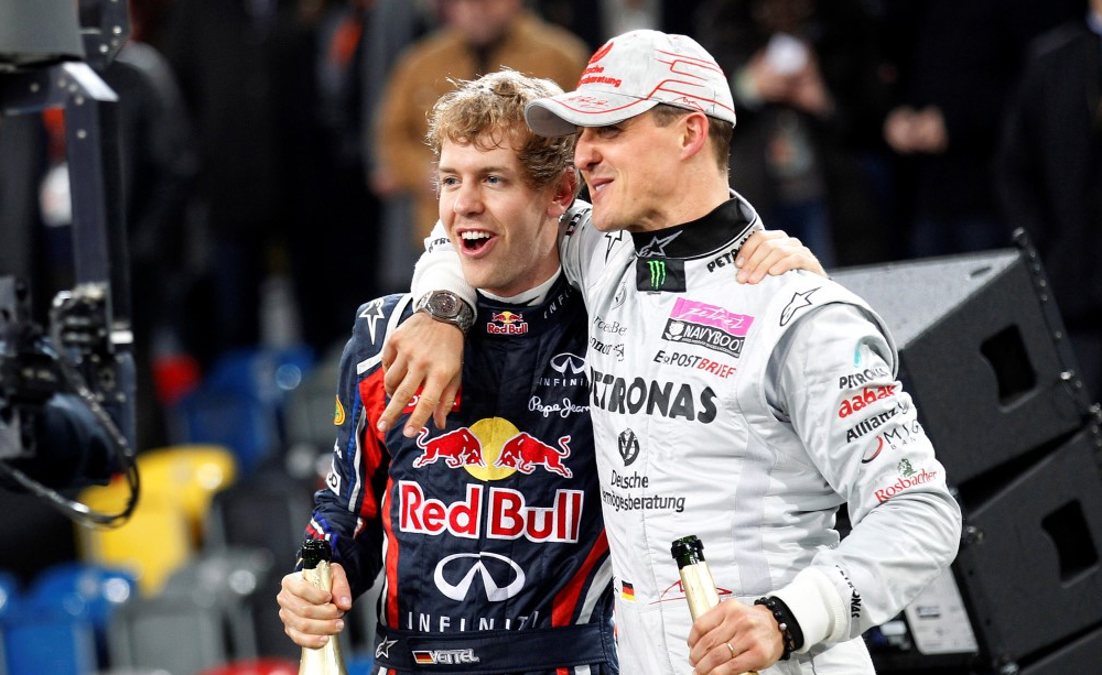Vettel ao lado de Michael Schumacher